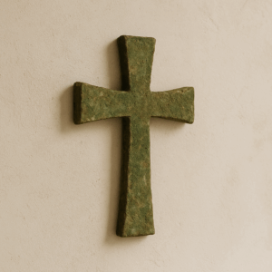 Moss-Patina Wall Cross with textured green and brown patina finish, mounted against a neutral background