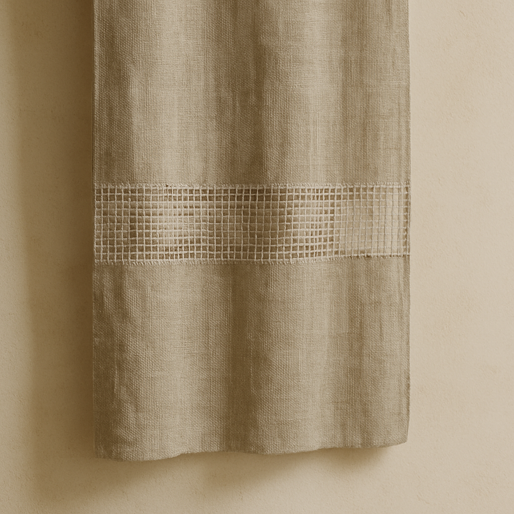 Close-up photo of a linen fabric with selective transparency against a neutral background